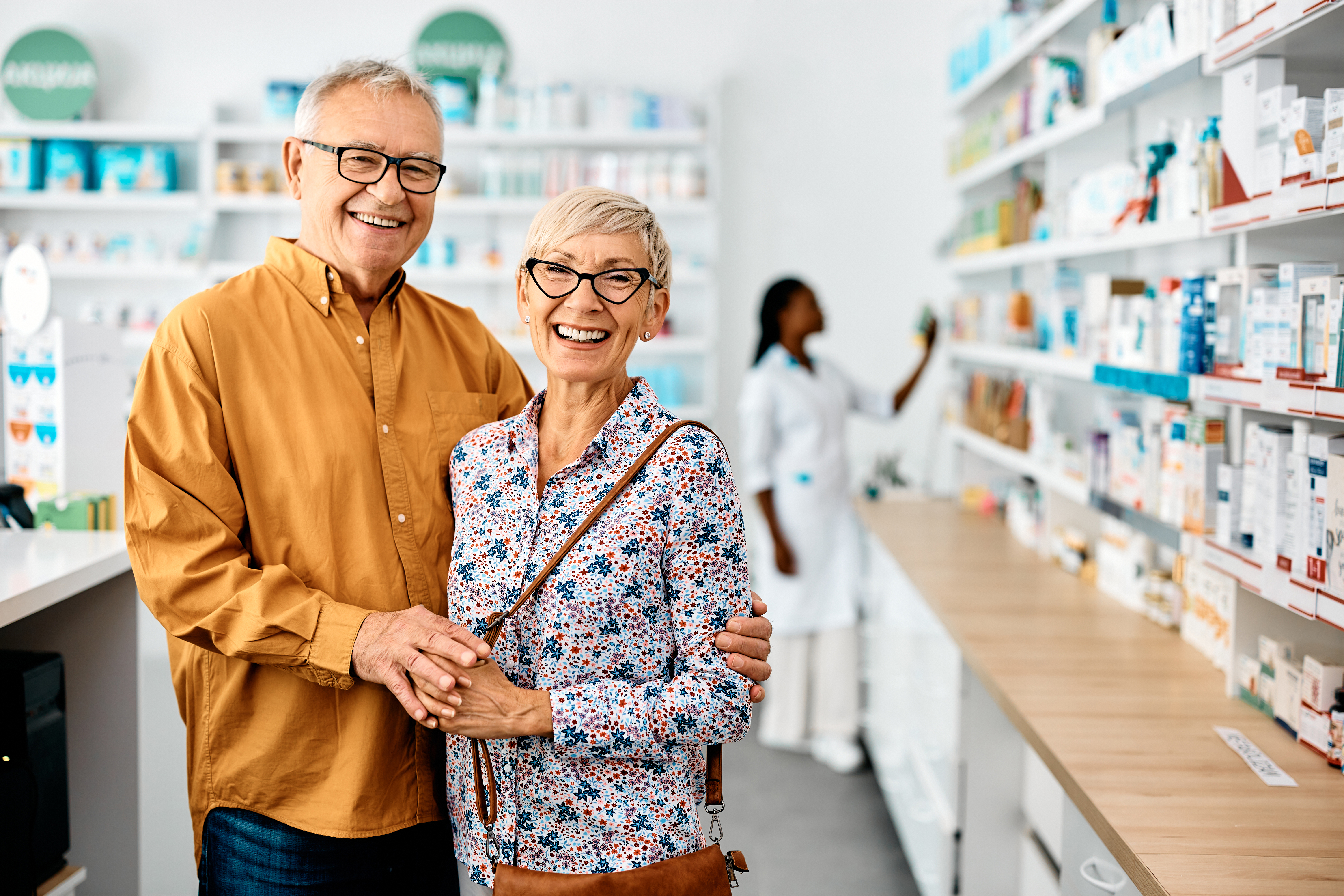 Senior couple reviewing prescription drug coverage